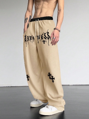 Manfinity Loose Fit Men's Sweatpants With Cross & Letter Graphics And Drawstring Waist