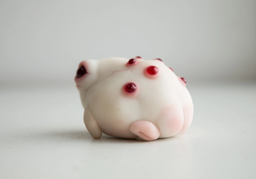 Cute art toy rain frog with albino eyes