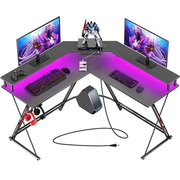 SEVEN WARRIOR L Shaped Gaming Desk with LED Lights & Power Outlets, 50.4” Computer Desk with Monitor Stand, Corner Desk with Carbon Fiber Surface, Gaming Table with Hooks, Black