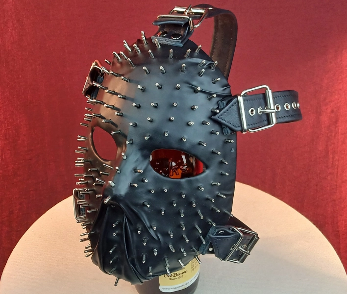 Closed Mouth Spikey Leather Face Mask with full head harness and belt and buckle detail.