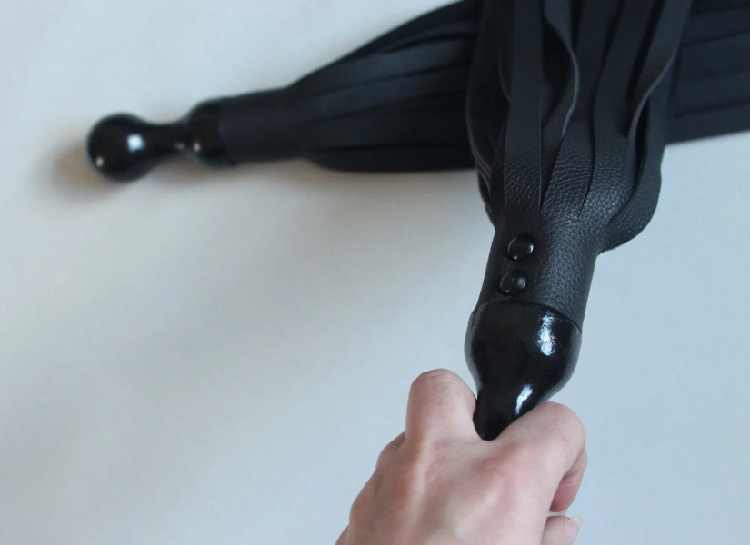 Pair of black poi floggers for florentine flogging