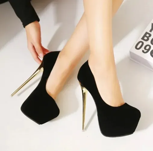Black pumps with a gold heeled accent
