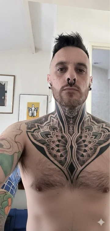 Chest/neck geometric tattoo