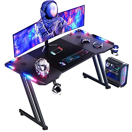 DLONGONE 120 x 60cm RGB Gaming Desk, Large Gaming Table for Laptop Home Office, Carbon Fiber Coated PC Desk with Headphone Hook and Cup Holder, Easy to Assemble, Black - 120 x 60 cm