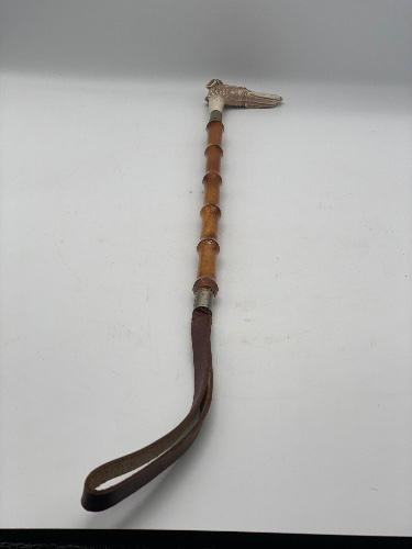 Antique leather & bamboo riding crop with very decorative whippet head handle.