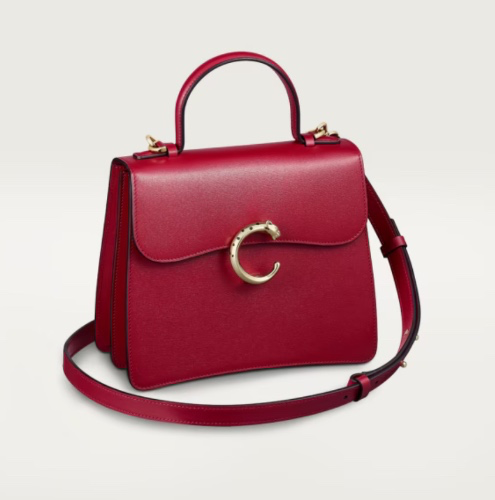 Top handle bag small model, Panthère de Cartier: Small handle bag in cherry red calfskin, golden and black enamel-finish clasp, golden “Cartier” signature hot-stamped on the inside. Two interior compartments