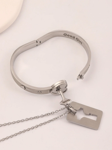 Permanent locking bracelet with key lock pendant