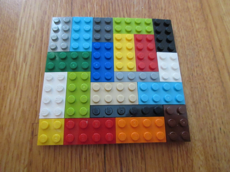 a set of two coasters made out of LEGO plate brick with a cork backing great colors size 4 x 4 inches and are unique the kids love them