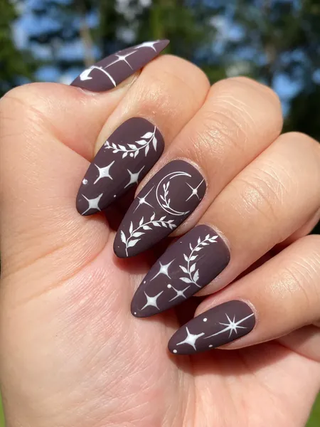Witchy celestial starry nails-maroon-burgundy press on nails-styled in medium almond