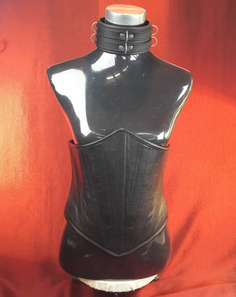 Male Corset in heavy black leather with solid front boning and rear lace up detail, fully boned and leather lined.