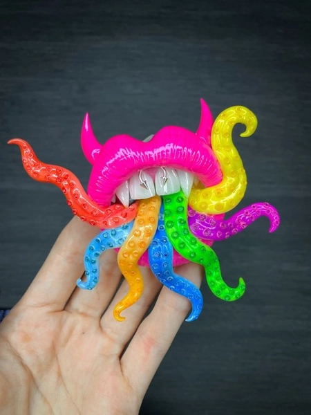 Phone grip. Pink lips with rainbow tentacles.