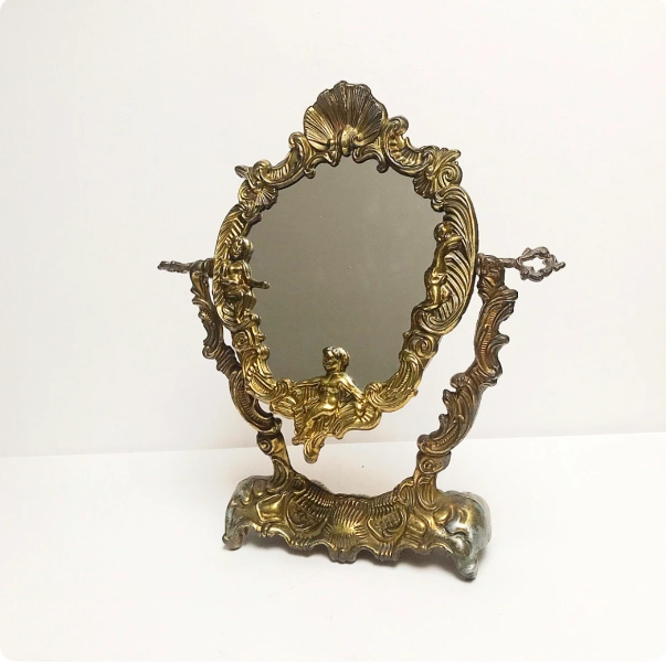Vintage brass-colored table mirror