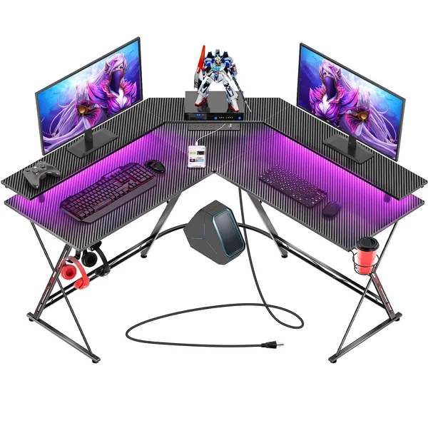 SEVEN WARRIOR Gaming Desk 50.4” with LED Strip & Power Outlets, L-Shaped Computer Corner Desk Carbon Fiber Surface with Monitor Stand, Ergonomic Gamer Table with Cup Holder, Headphone Hook, Black