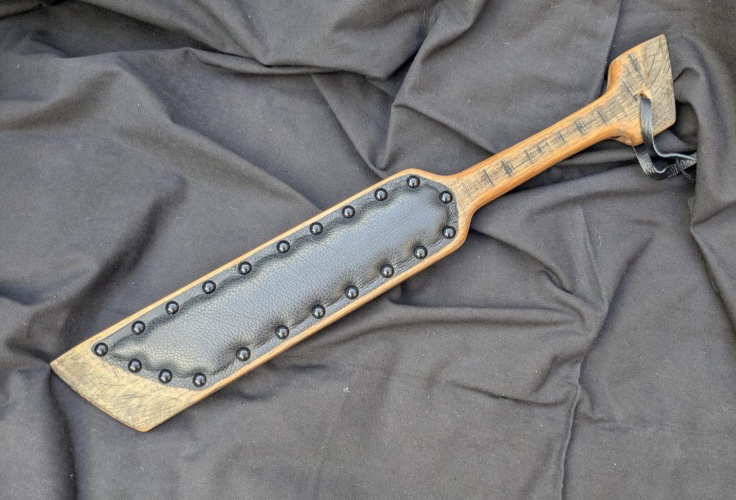 Hand crafted padded wooden paddle