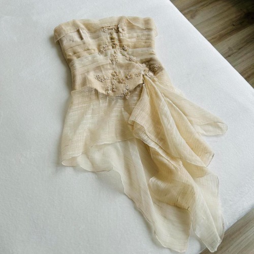 Rare embellished strapless creme bustier with flowy...
