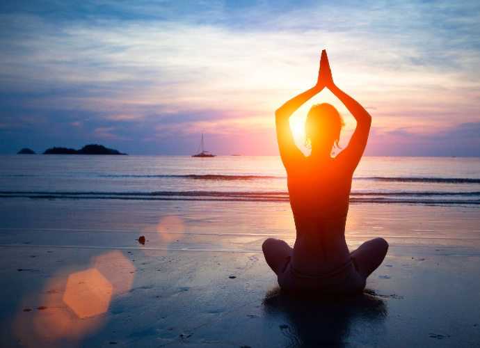 By weekly yoga classes 