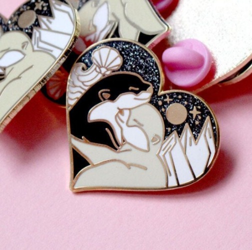 Pin corazón nutrias