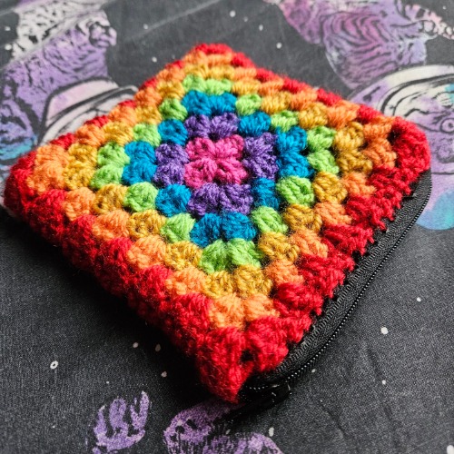 Handmade rainbow crochet dice pouch