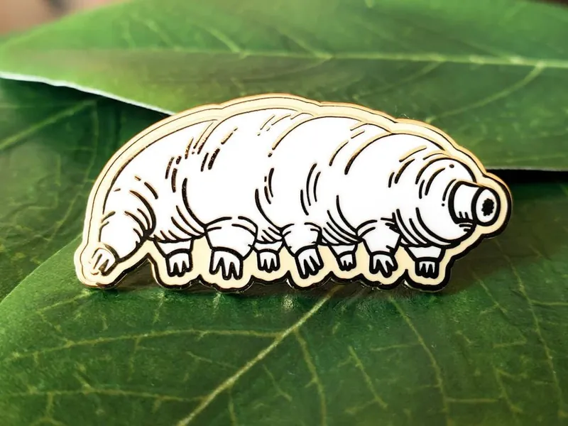 Enamel pin // Tardigrade hard enamel pin, biology science microbiology, white and gold