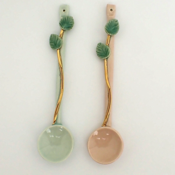 teaspoons with 2 leaves and a golden branch
