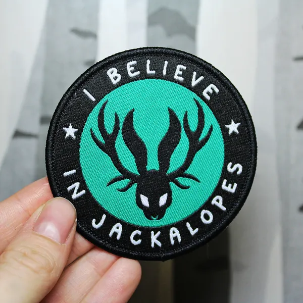 Jackalopia - 'I Believe In Jackalopes' Iron On Woven Patch 7cm
