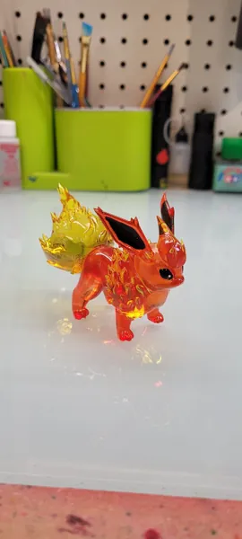 Flareon figurine from Pokemon, a custom figurine, 3D printed in clear resin and hand painted figurine.